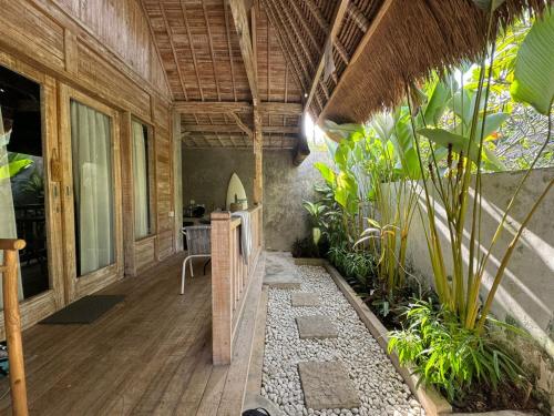 an indoor garden with plants in a house at Sampian Cottages Bingin in Uluwatu