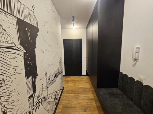 a hallway with a drawing on the wall at F&R Sea Bliss Apartment in Gdańsk