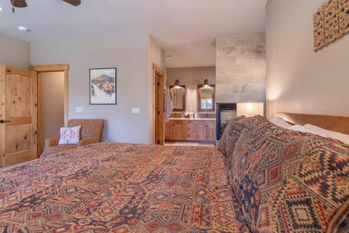 a bedroom with a large bed and a bathroom at Deluxe Truckee Townhome 3BDR Dog Friendly Great Location in Truckee
