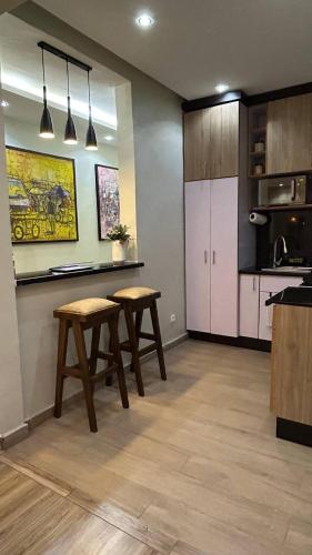 Virtuvė arba virtuvėlė apgyvendinimo įstaigoje Logement Mwayé