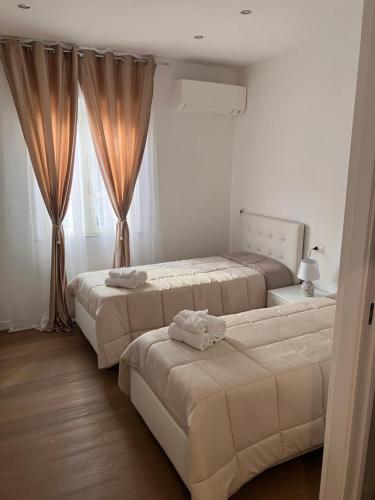 Ένα ή περισσότερα κρεβάτια σε δωμάτιο στο Beb Napoli flegrea