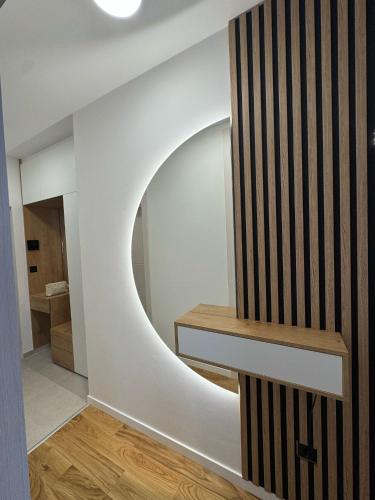 a room with a round mirror on the wall at Julie Apartment Sarajevo in Donje Mladice