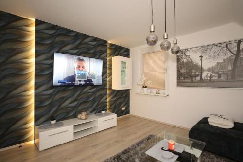 TV a/nebo společenská místnost v ubytování Ferienwohnung Bornweg