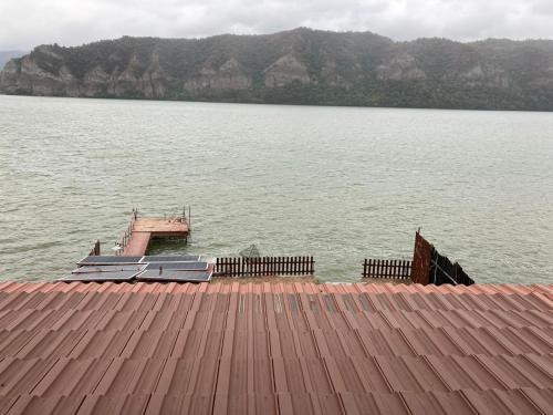 a dock on a large body of water at Vila Bohemia in Sviniţa