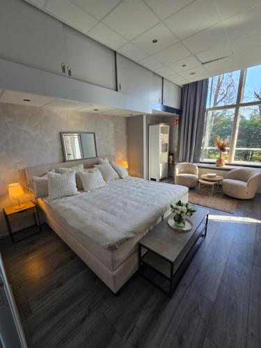 Postel nebo postele na pokoji v ubytování Hart van Warder