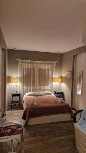 a bedroom with a large bed and a window at Il Mare Di Roma Luxury in Lido di Ostia