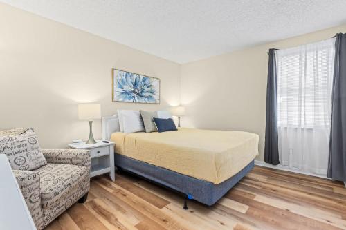 a bedroom with a bed and a couch at Modern Condo Just Steps from the OC Boardwalk in Ocean City