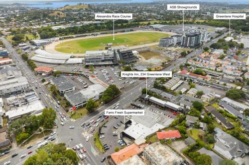 an aerial view of a city with streets and buildings at Knights Inn in Auckland