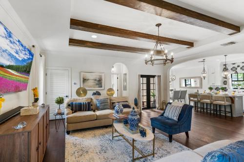a living room with a couch and a table at Elegant 4BR Home Guest House Private Yard in West Palm Beach