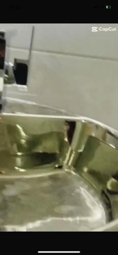 a close up of a sink in a bathroom at Games village Suites in Abuja