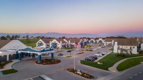 an aerial view of a town with cars in a parking lot at Staybridge Suites Oxnard - River Ridge by IHG in Oxnard