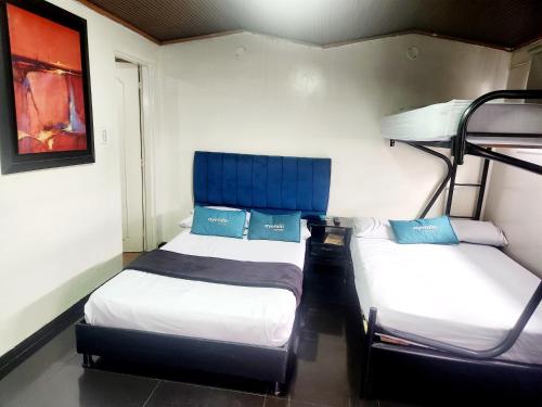 Cama o camas de una habitación en Hotel Bogota Home