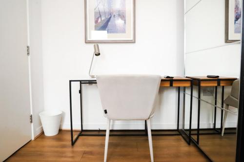 a white chair sitting at a desk in a room at Great location, direct links to London Bridge! in Forest Hill