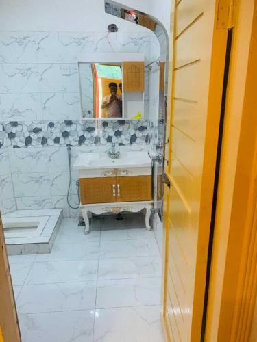 a bathroom with a sink and a mirror at Chinar Resort Keran Neelam Valley in Shāhkot