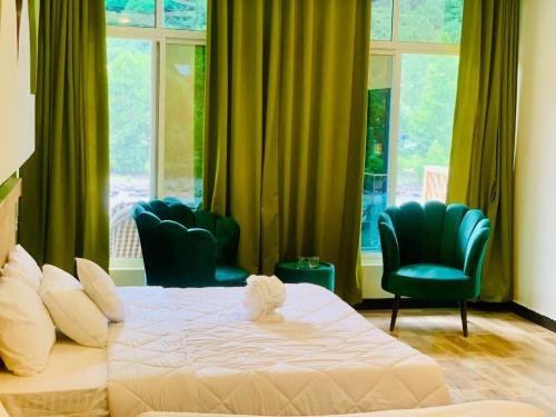 Postel nebo postele na pokoji v ubytování chinar resort