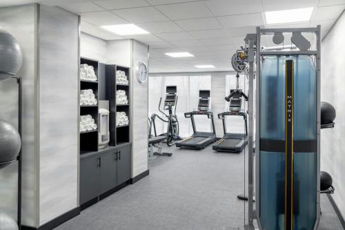 a gym with treadmills and elliptical machines at Fairfield by Marriott Inn & Suites Detroit Taylor in Taylor