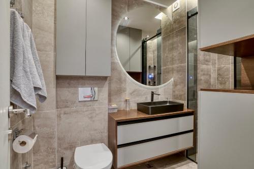 a bathroom with a sink and a mirror at Luxury Suite Veselić in Valjevo