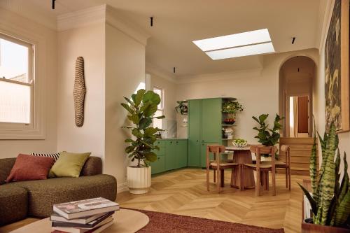 a living room with a couch and a table at Mucca Suite in Sydney