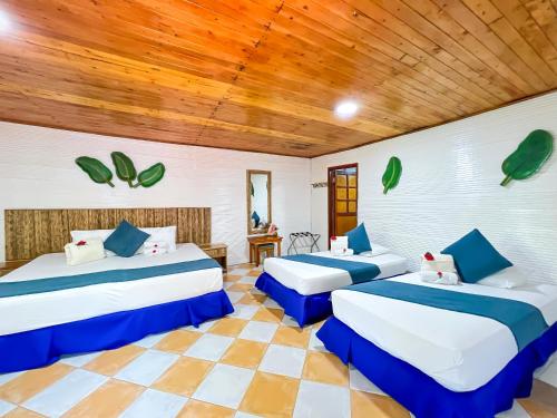 Postel nebo postele na pokoji v ubytování Hotel Isla Palma Reserva Natural