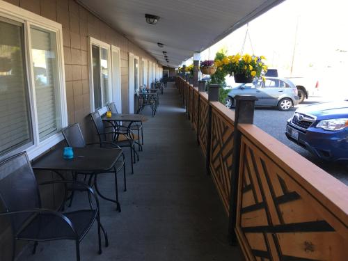 a row of tables and chairs on a patio at Sunset Motel in Cache Creek