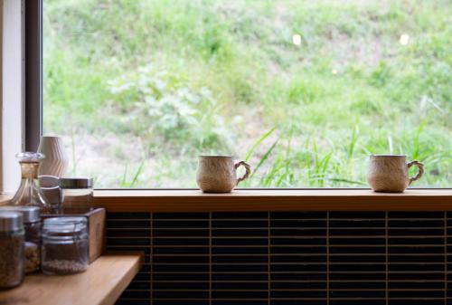 Taman di luar 猫と図書館のある宿 草地家 Kusachike