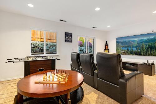 a living room with a chess set on a table at Ultimate Group Getaway Near Ferry, Hot Tub and Games in Mukilteo