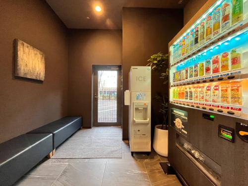 a waiting room with an ice machine in a store at Hotel Route Inn Grand Fukushima Ekimae Higashiguchi in Fukushima