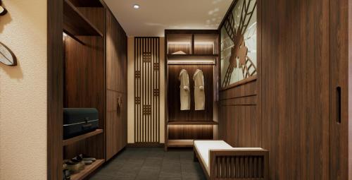 a dressing room with wood paneling and a hallway at Amiana Resort Cam Ranh in Cam Ranh