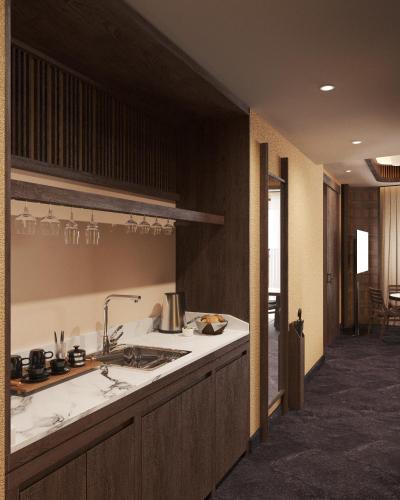a kitchen with a sink and a counter top at Amiana Resort Cam Ranh in Cam Ranh