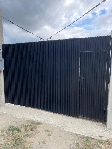 a black fence with a gate in front of it at 4BR Villa with Pool in Calatagan Batangas up to 16 Guests in Calatagan
