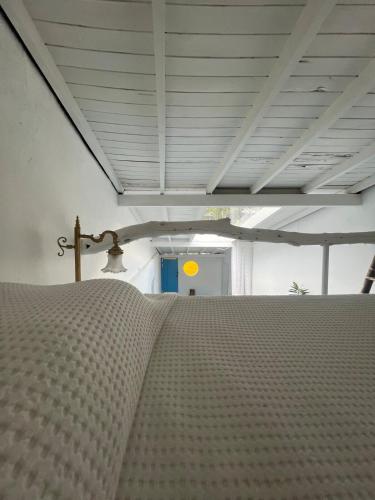 a bed in a room with a bedspread on it at Casa Cielo in Concepción