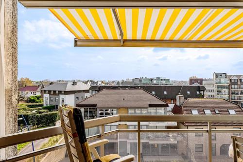 a balcony with a view of a city at Stephanie 0406 G30 in Sint-Idesbald