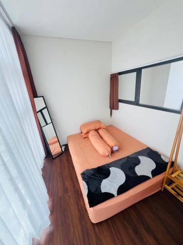 a small bedroom with a bed in a room at Embun Pagi villa - Habitat 110 in Batu
