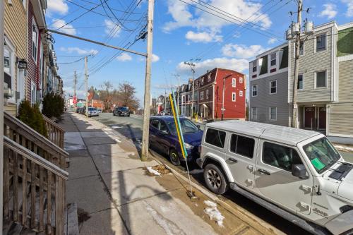 a silver limo parked on the side of a street at Queens Suite 1bdrm in St. John's