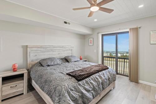a bedroom with a bed and a ceiling fan at Jersey Shore Getaway in Seaside Heights