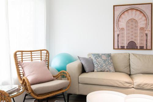 a living room with a couch and a chair at Brewers Haus - Willunga - C21 SouthCoast Holidays in Willunga