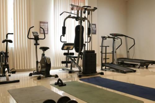 a gym with several exercise bikes and tread machines at Bale Ocasa by Behomy in Tangerang