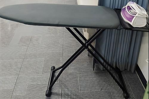 a chair with a phone sitting on top of it at Bluebird Hotel in Incheon