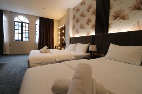 Postel nebo postele na pokoji v ubytování Casa Colney Hotel Ipoh