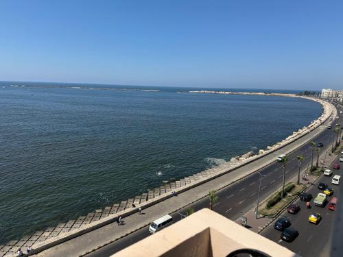 a highway next to a body of water with traffic at S Hotel in Alexandria