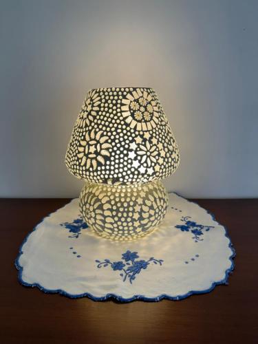 a lamp sitting on top of a table at Cim and Sands in Goa