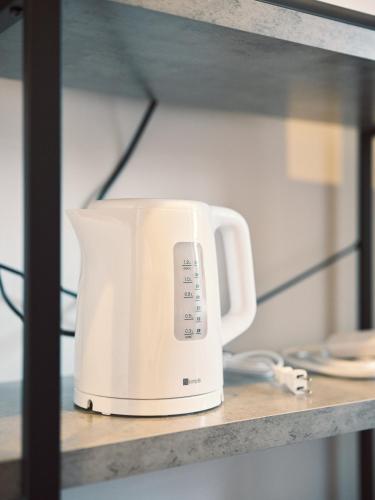 a white toaster sitting on a shelf at vetta Minami-Kumamoto Station 803 in Kumamoto