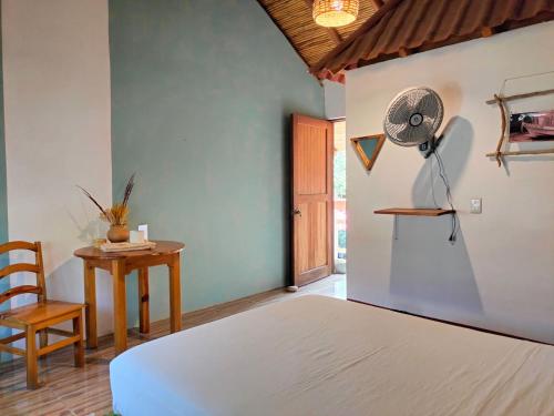 Ένα ή περισσότερα κρεβάτια σε δωμάτιο στο Casa H Rinconcito Mazunte