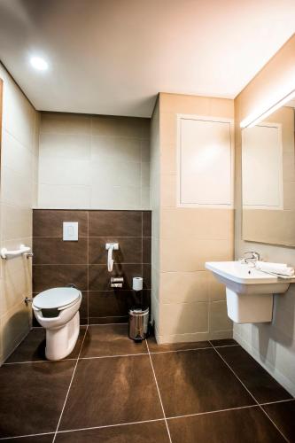 a bathroom with a toilet and a sink at Citea Apart Hotel in Beirut