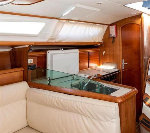 a kitchen with a glass counter top in a boat at Sailing on Luxury Yacht in Mumbai
