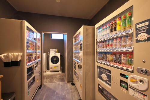 a vending machine in a store with many drinks at Hotel Route Inn Ginan -Kokudo 21 Gou- in Ginan
