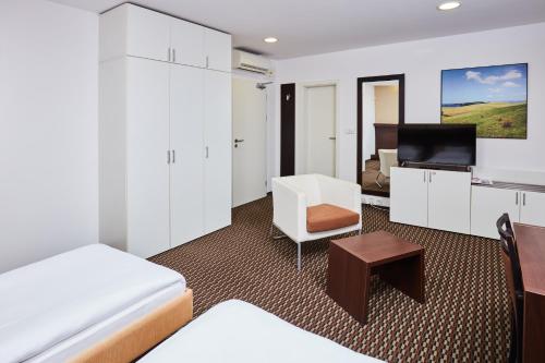 Postel nebo postele na pokoji v ubytování Hotel Rottal