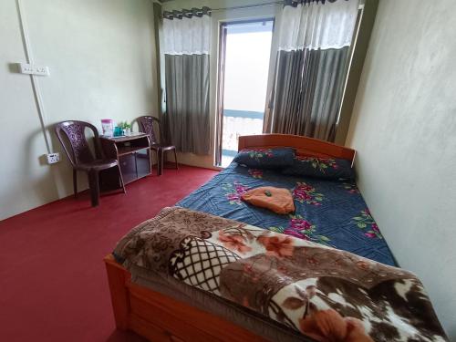 Ένα ή περισσότερα κρεβάτια σε δωμάτιο στο Hes-Perus Homestay