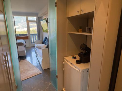 a kitchen with a washer and dryer in a room at Bergträumerei in Bad Goisern