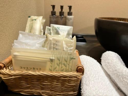 a basket of toiletries sitting on a table at Oyado Koto No Yume in Takayama